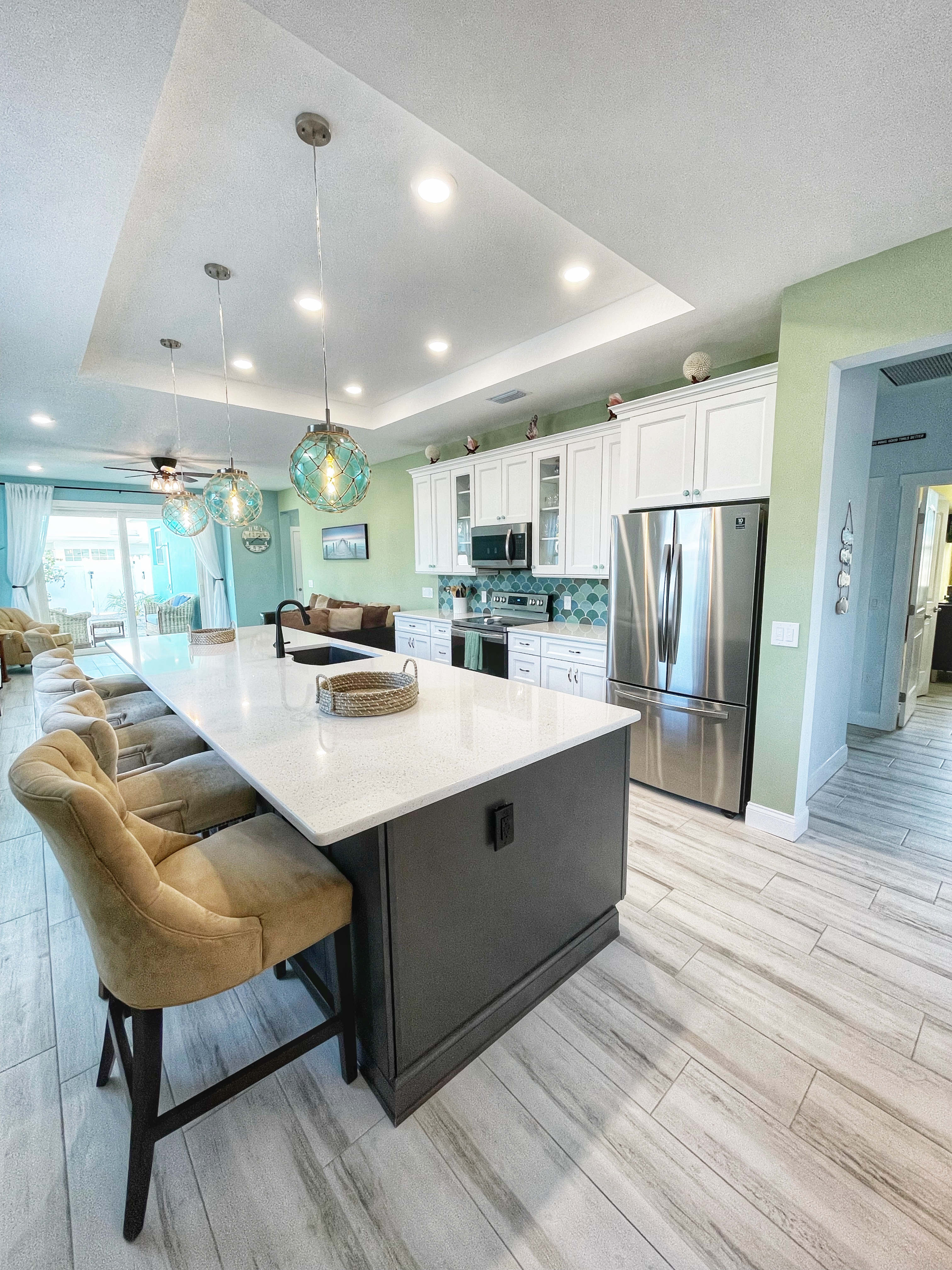 Kitchen cooking area with range and hood